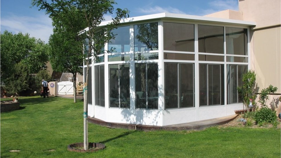 white framed sunroom addition from exterior