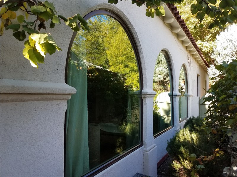 exterior of white home with curved windows