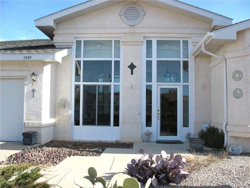 exterior of home with big white framed windows