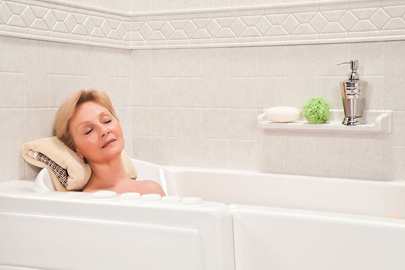 woman sitting in bathtub