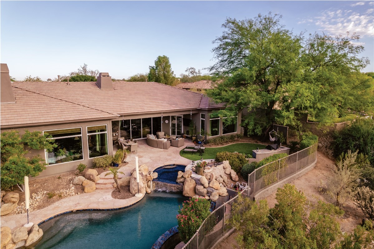 exterior of home with trees and pool