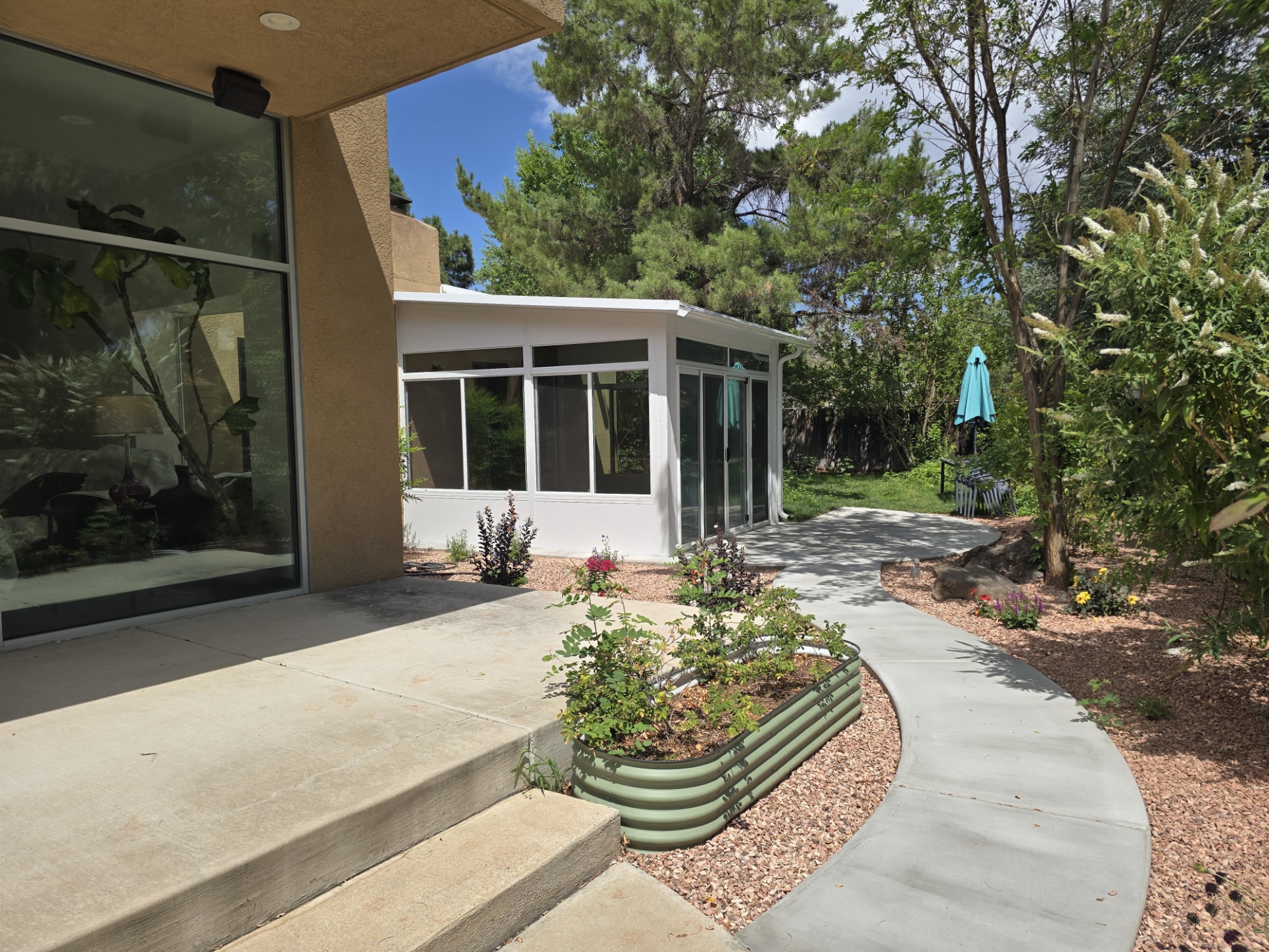 Synthetic turf landscaping around a patio