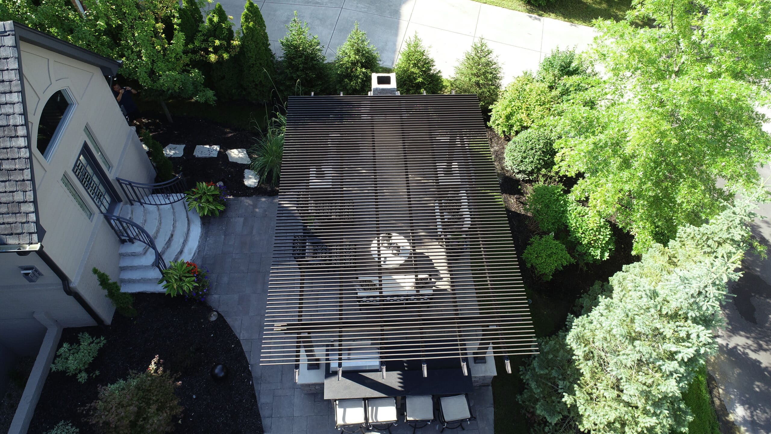 Overhead view of a pergola and landscaped backyard