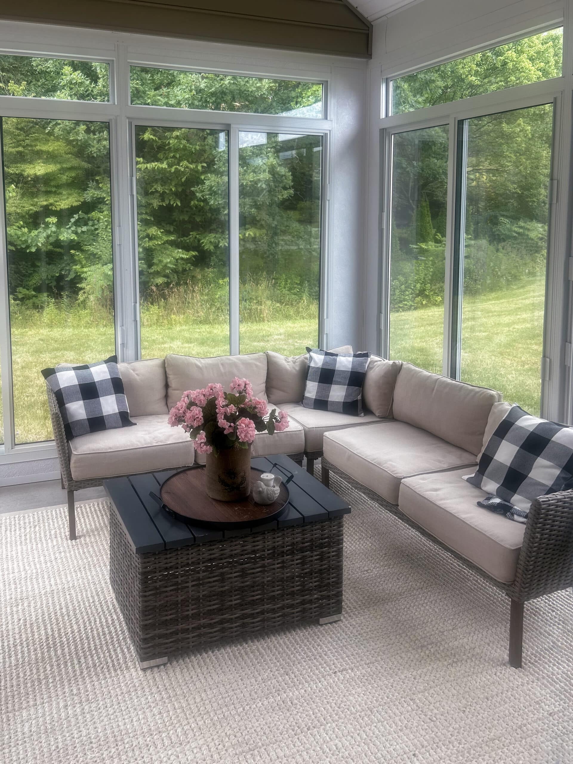 Custom sunroom interior with seating and garden views
