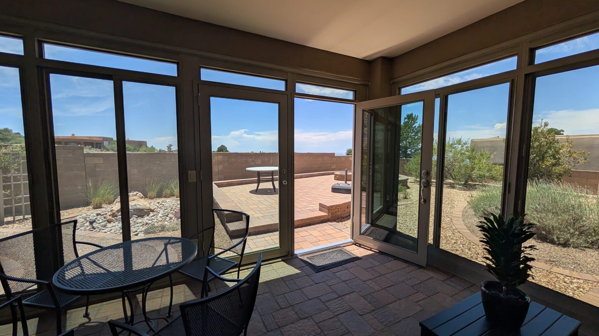 Sunroom interior overlooking a desert landscape