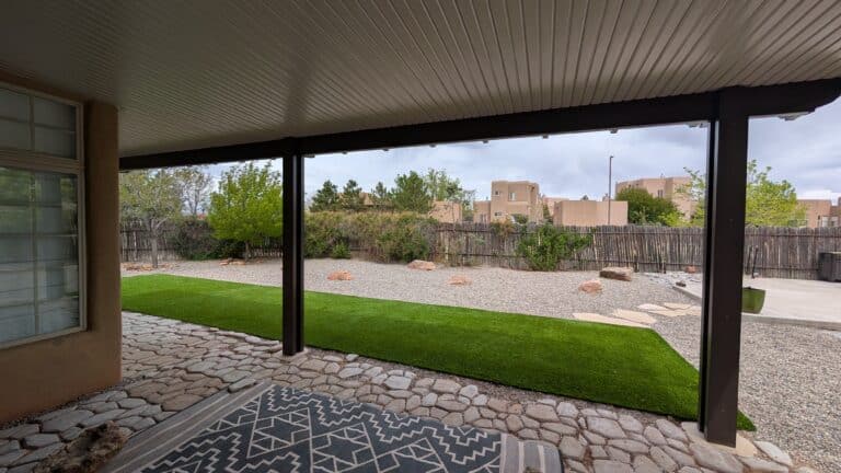 Covered patio overlooking a green lawn
